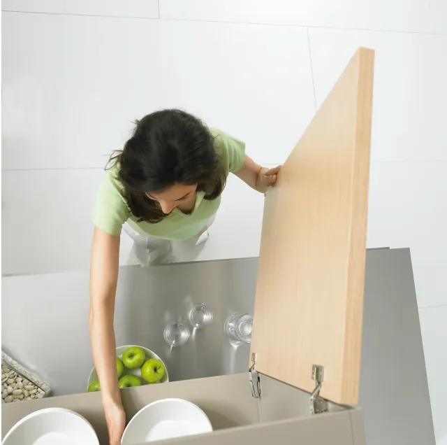 Maid organizing kitchen