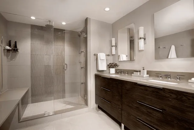 Tiled walk-in shower and vanity wall