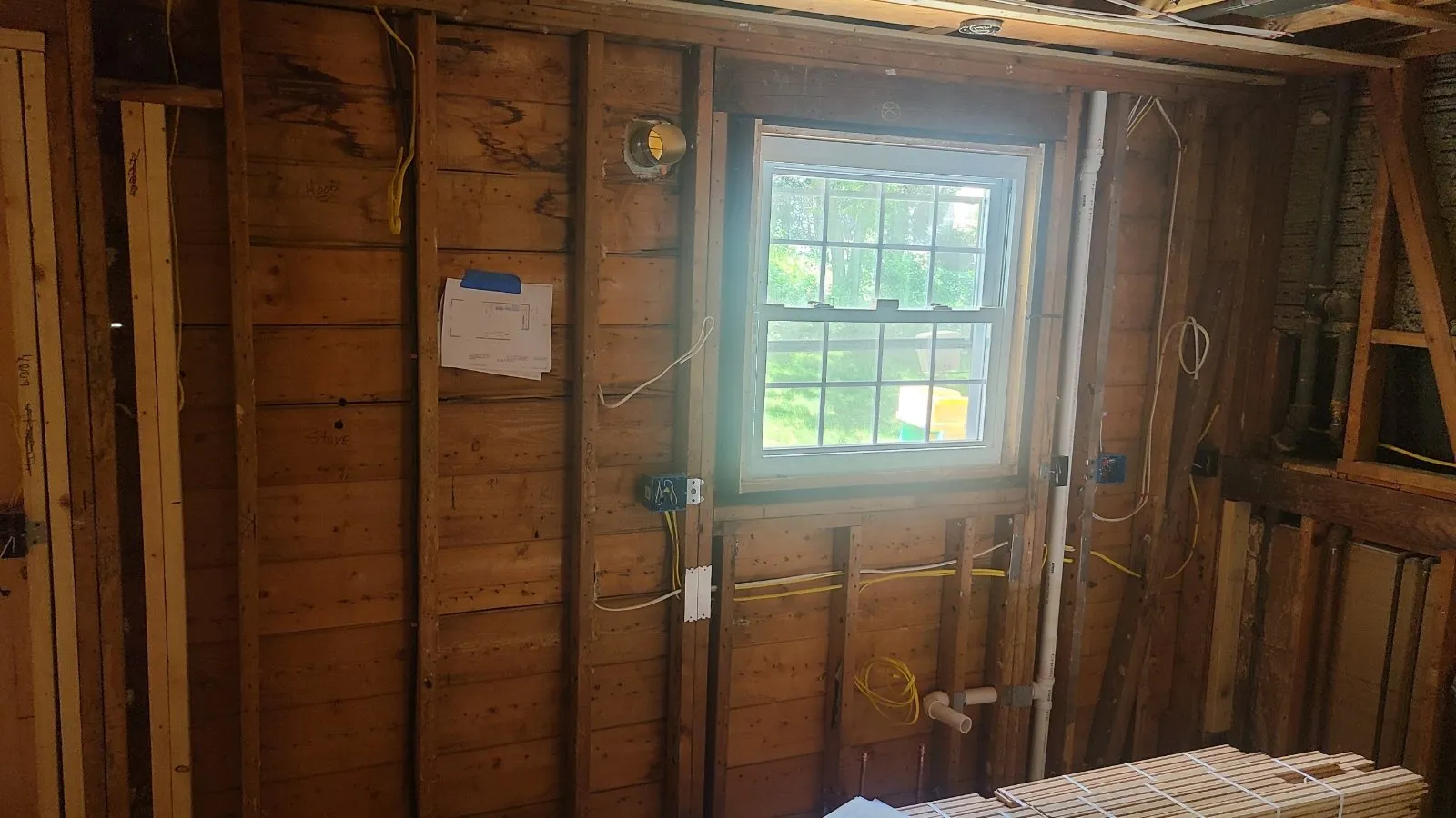 Wall opened to studs during a gut renovation