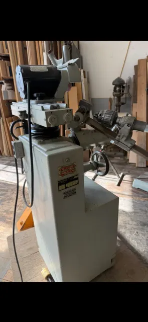 Large stationary Oliver shop machine inside a workshop
