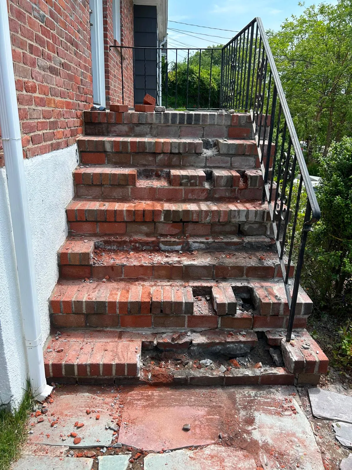 Damaged brick steps before restoration