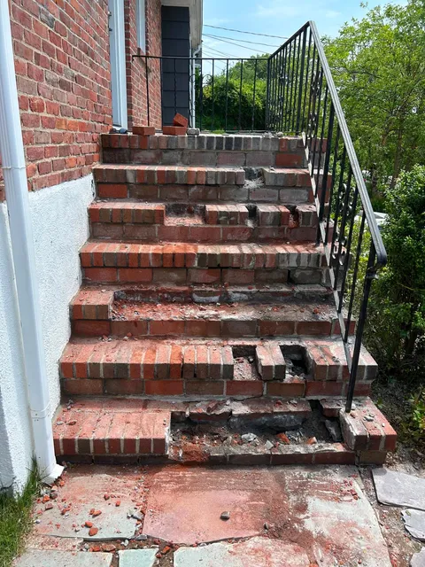Damaged brick steps before restoration