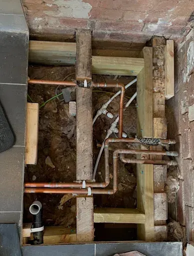 Copper and PEX repipe under a lifted floor with new drain lines
