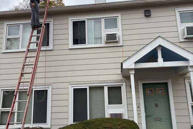Chimney flashing and surrounding shingle replacement on a Medford residence.