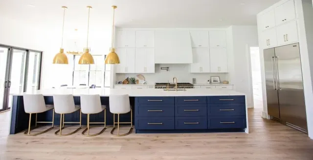 white wooden kitchen cabinet with black pendant lamp