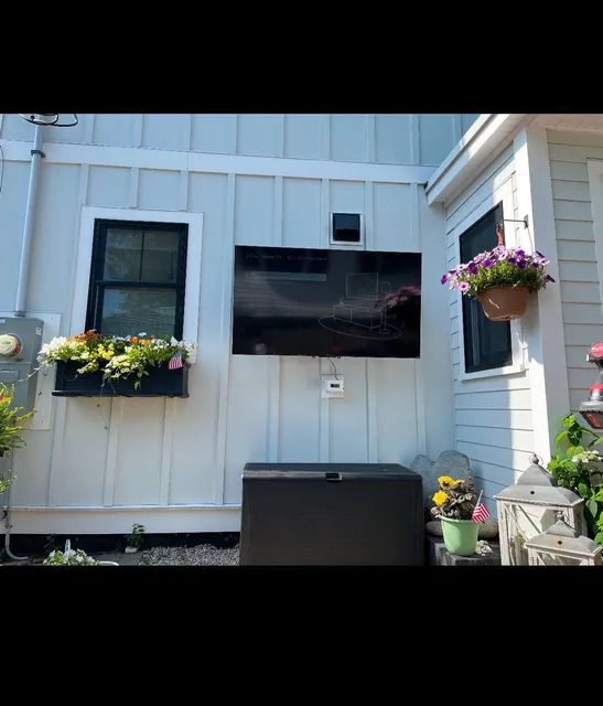 Exterior outlet and mounting work on a home