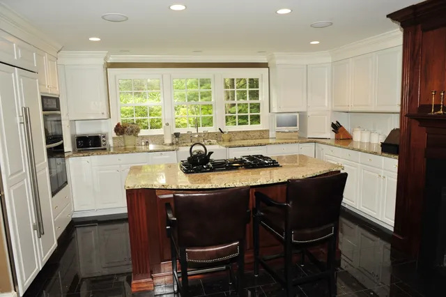 White kitchen with granite island