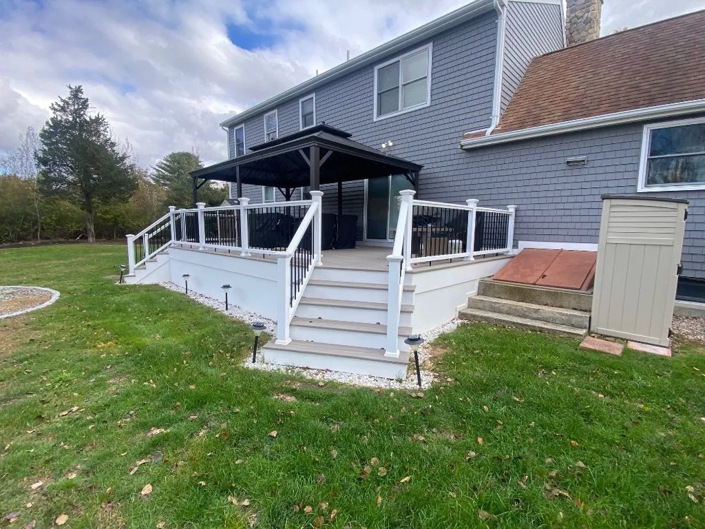 Spacious back deck featuring a shaded gazebo area