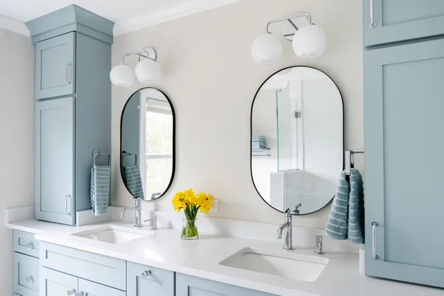 Double Vanity with Blue Custom Cabinetry by Marlene & Co