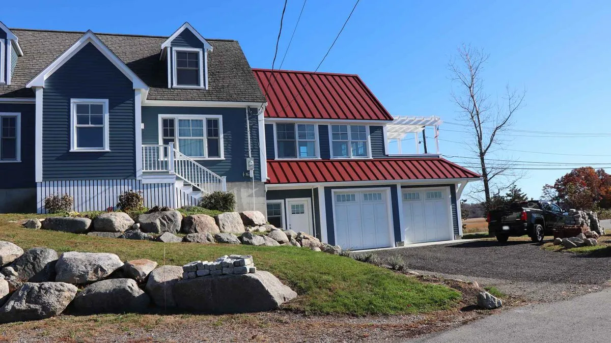This project involved building a beautiful two-story addition, creating a two-car garage with a finished sun room and deck above. The addition was complemented by new windows and siding of the existing house.
