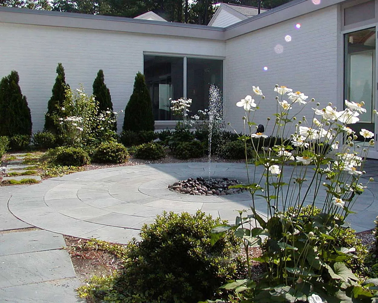 Courtyard-featuring-a-bluestone-terrace-and-sunken-fountain-in-Topsfield-MA