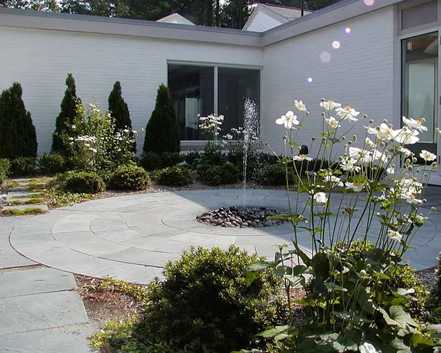 Courtyard-featuring-a-bluestone-terrace-and-sunken-fountain-in-Topsfield-MA