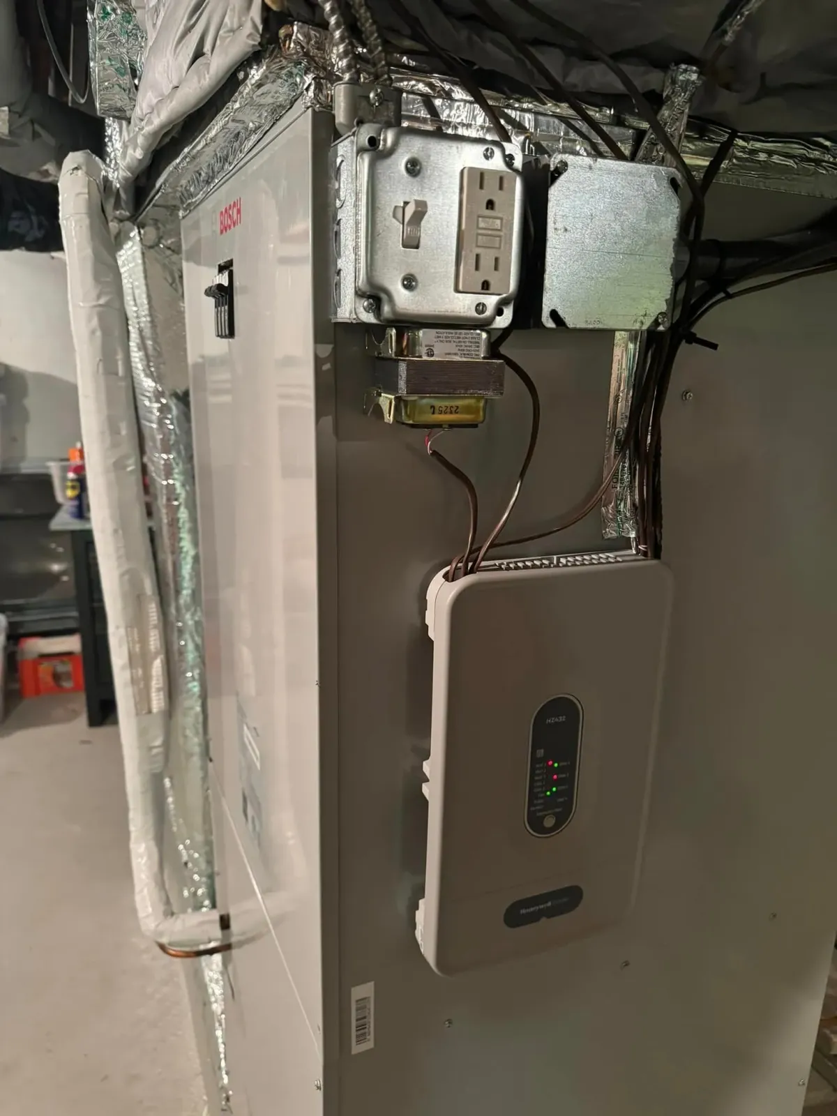 A picture of a heating and cooling system in a basement.