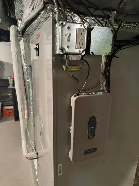 A picture of a heating and cooling system in a basement.