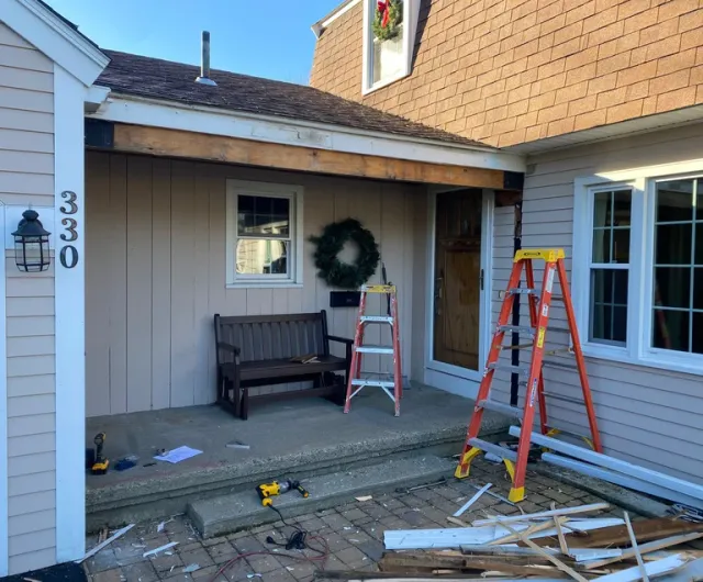 Breezeway addition under construction in Whitman MA by SJ Wilson Construction.