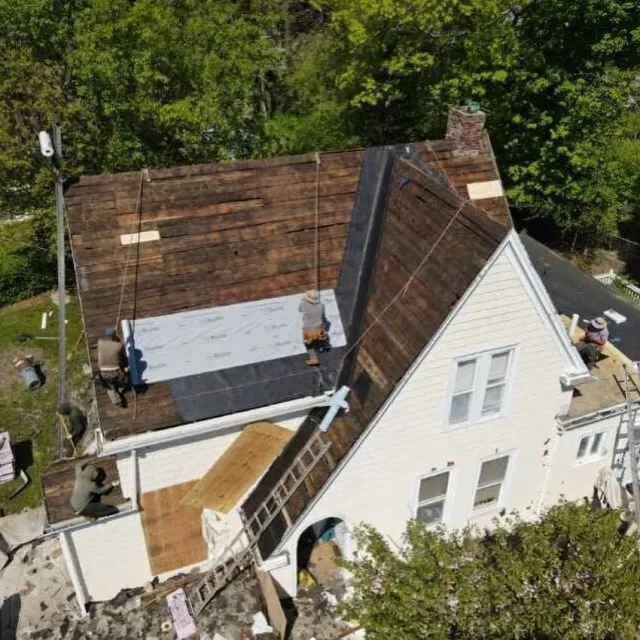 Dropped a garage, repointed a chimney and a brand new roof with a lifetime warranty!