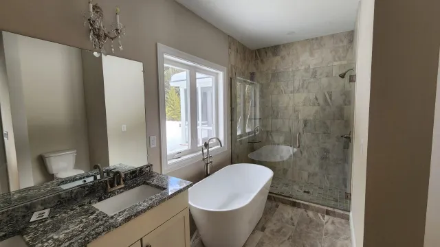 Bathroom with freshly painted walls and trim by Honest Brothers Painting LLC in Southern New Hampshire.
