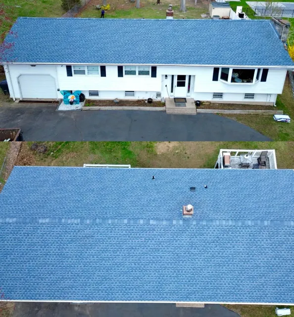 Aerial view of a white single-story house with a blue roof and driveway, shown from front and above.