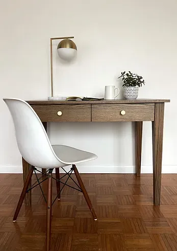 Solid oak and oak veneer desk with a hand-applied Earth finish. Features two spacious soft-close drawers with brushed brass k