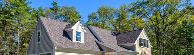 Home on a wooded lot with a two car garage