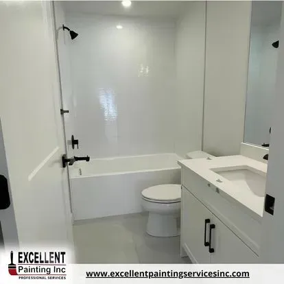 A bathroom with a sink, toilet, bathtub and shower.