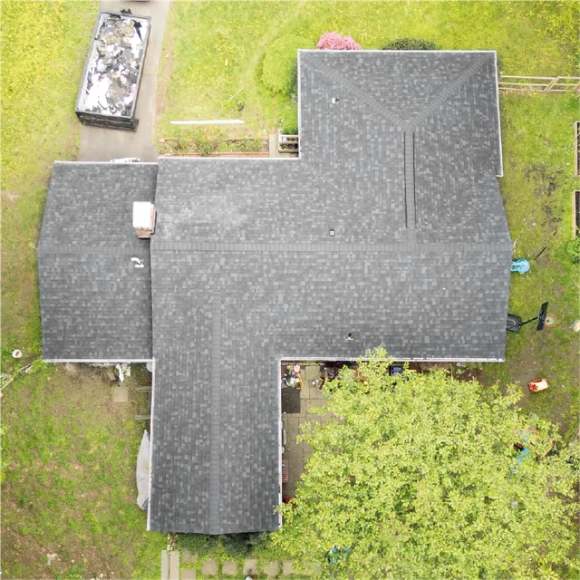 Completed grey shingle roof on multi-section Connecticut home