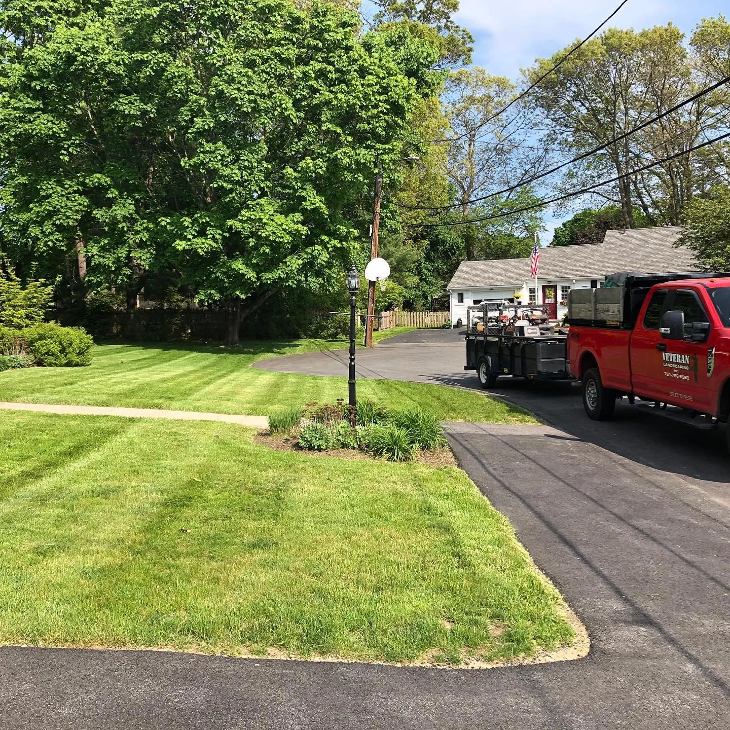 Company truck parked on a mown property