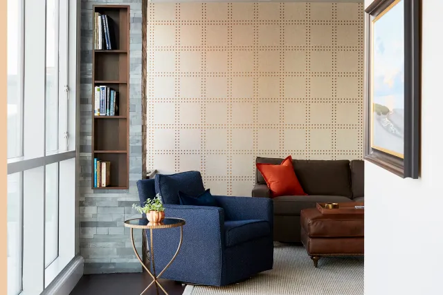 Living room with custom paneling and shelving