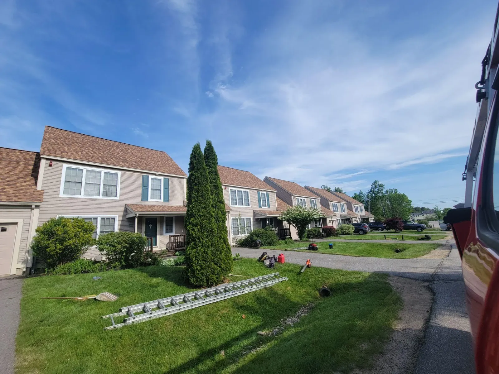 Completed asphalt shingle roof replacement on a residential townhome complex by Northpoint Roofing