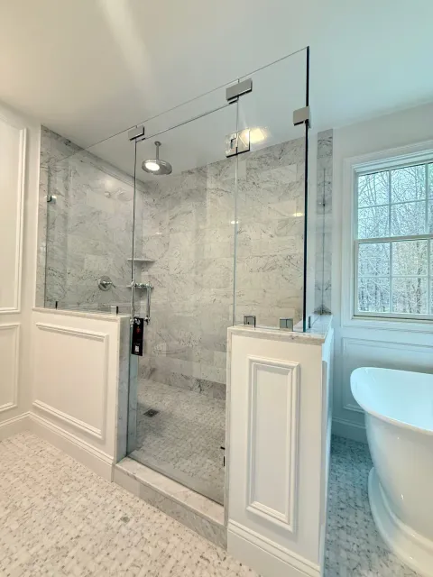 Classic frameless shower with chrome hardware