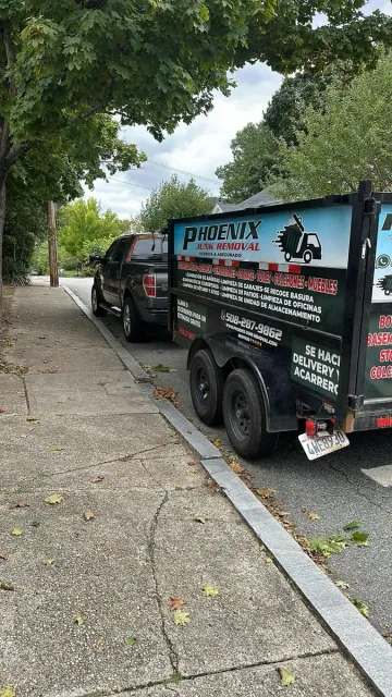 Phoenix Junk Removal Dump Trailer parked in Rhode Island
