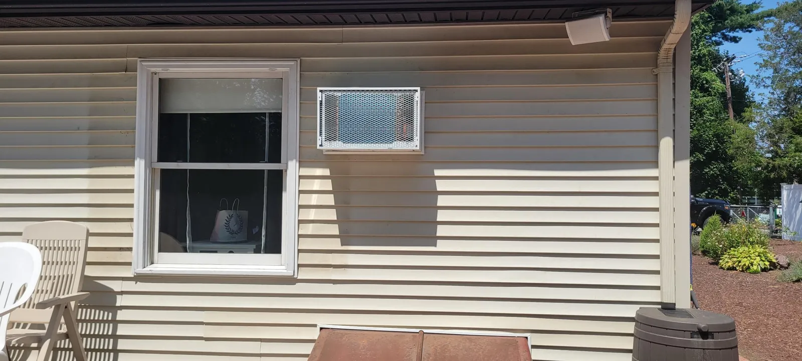Through-wall AC unit installed in siding