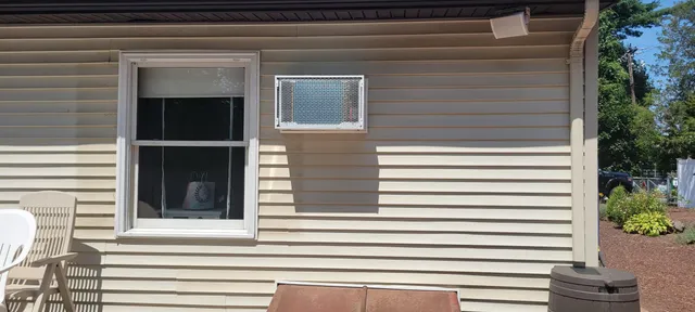 Through-wall AC unit installed in siding