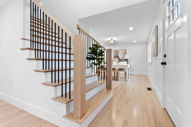 New staircase with white oak treads and metal railing