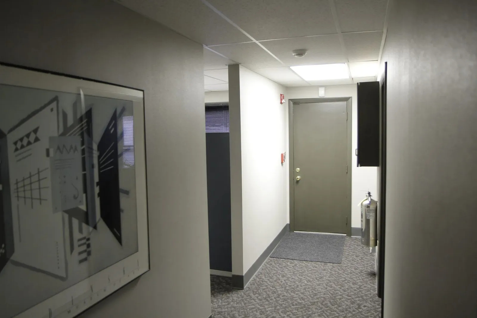 A hallway with a picture on the wall