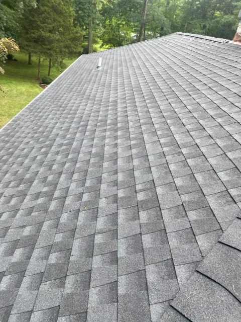 Close-up of architectural asphalt shingles installed by Apex Roofing