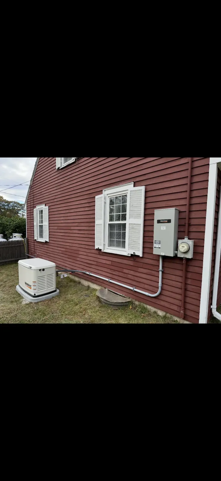 Three new electrical service panels installed in a basement in Taunton, MA with overhead conduit runs