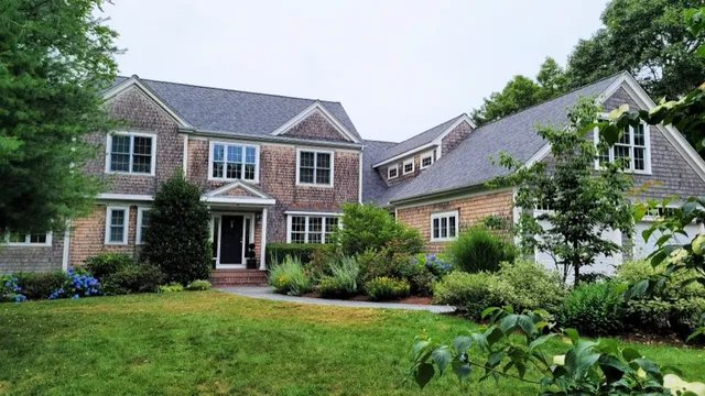 Completed roof replacement in Plymouth, MA with Estate Gray shingles