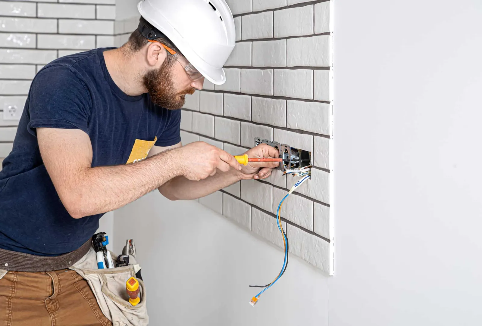 Electrician working in kitchen