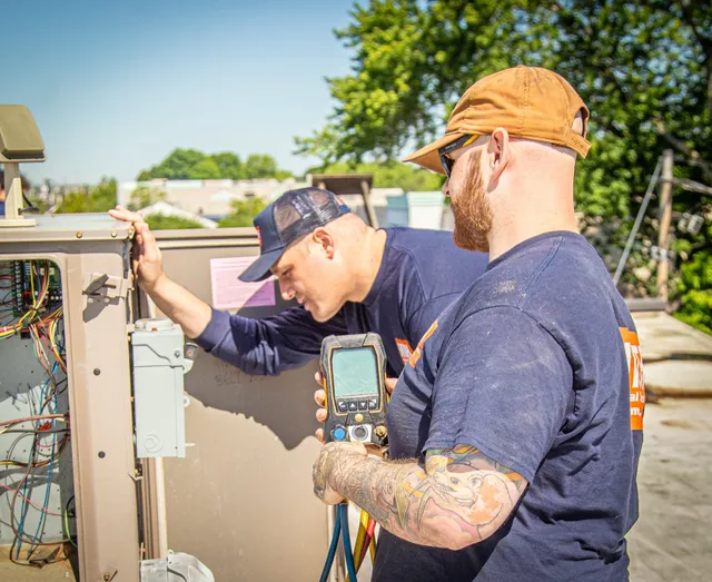 Technicians with diagnostic equipment