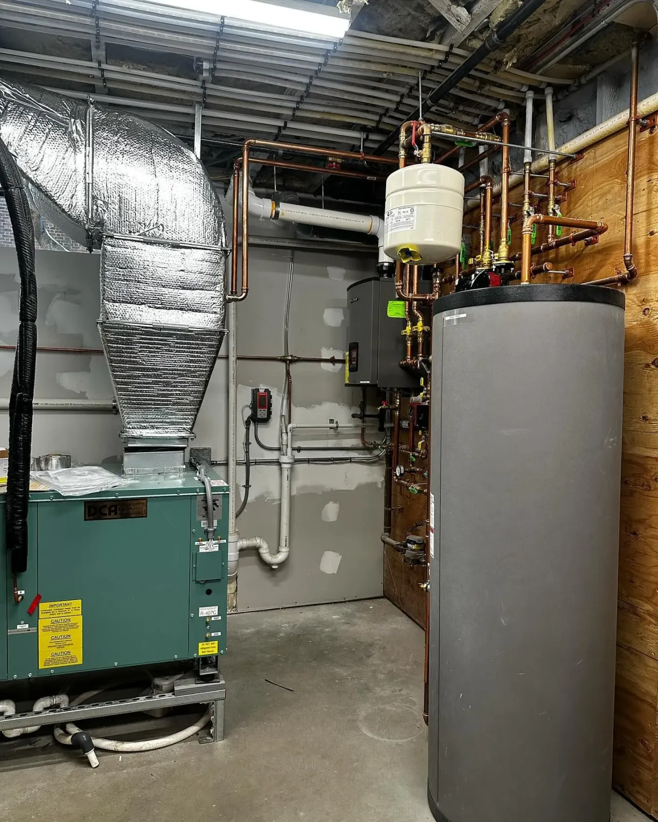 a room with a heater and a water heater in it