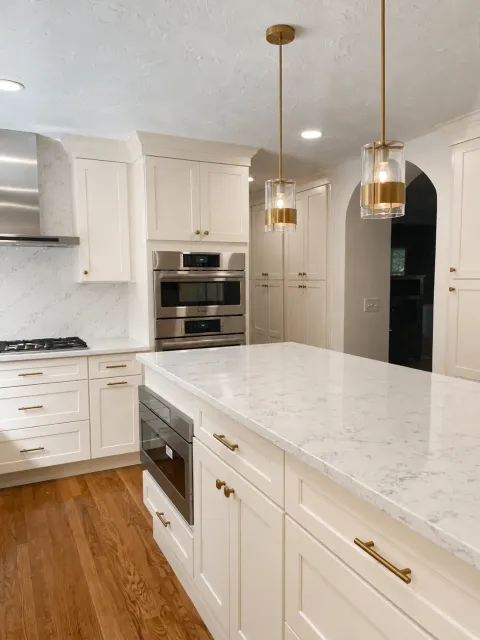Renovated kitchen after remodel with new cabinets and countertops
