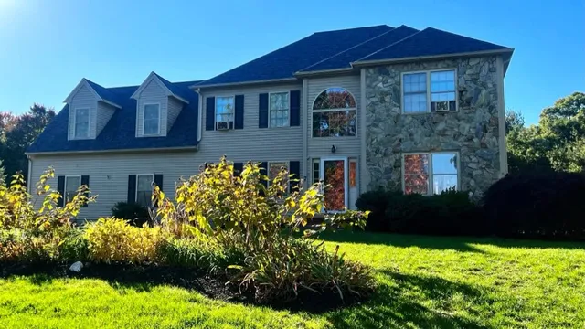 Completed roof replacement in Mansfield, MA with Estate Gray shingles