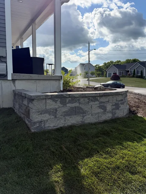 Tiered retaining wall with landscape lighting