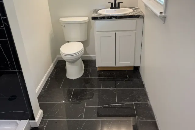 Black Marble-Look Bath Floor tile installation in New Britain, CT by Dmtilellc