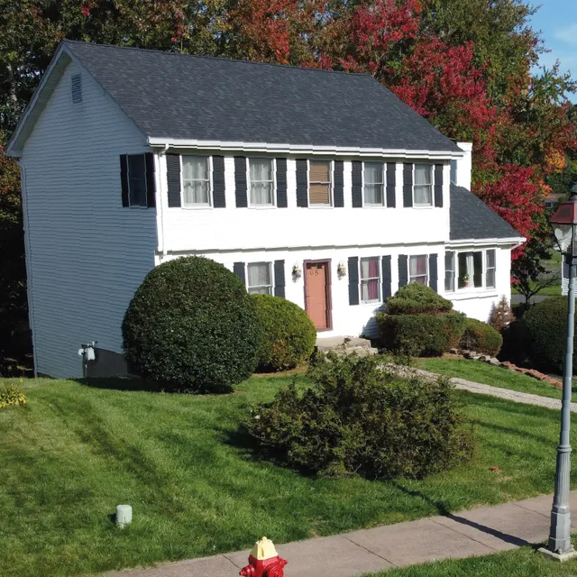 White colonial Connecticut home with new architectural shingle roof