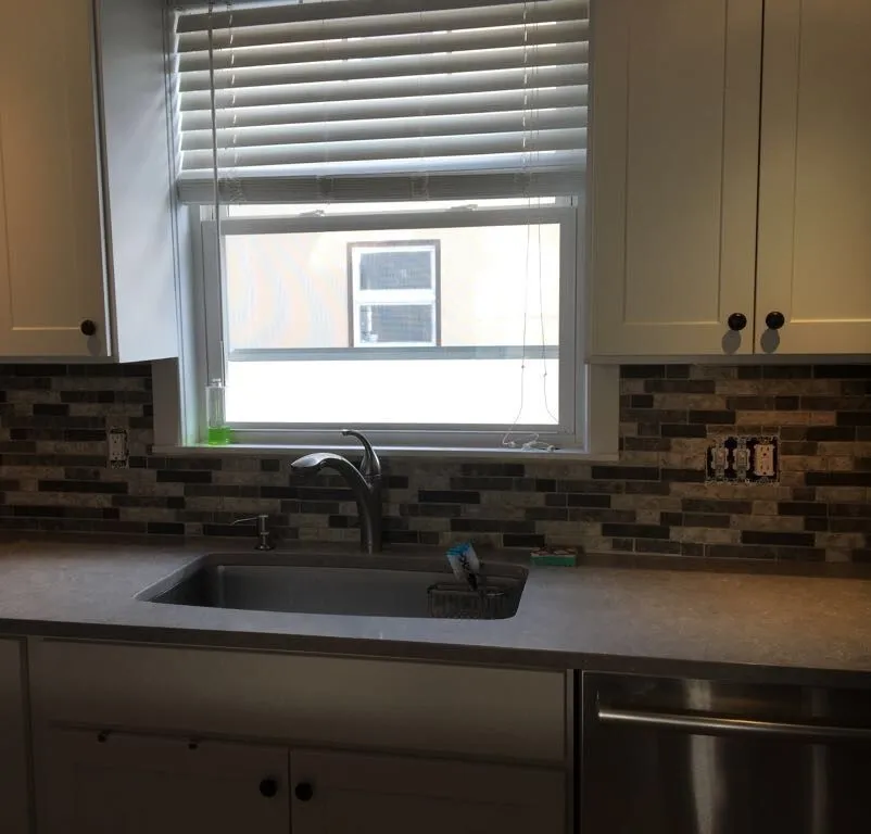 Kitchen sink, counter and tile backsplash