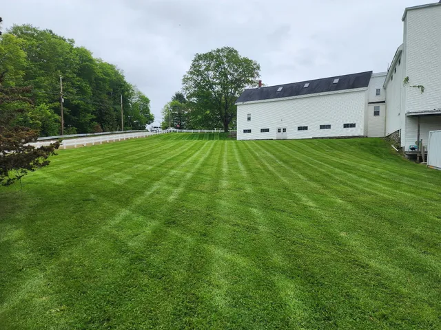 Landscaping team working in Strafford County, NH residential yard