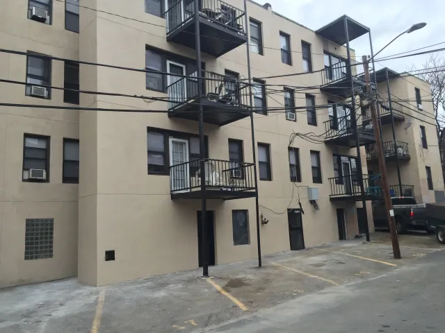 Complete stucco project done for a property management company  Services provided:  - Lift work  - Demo and replacement of brick  - Formed and wrapped 40’ exhaust pipe with fire rated studs and concrete board  - Mechanically fastened galvanized wire