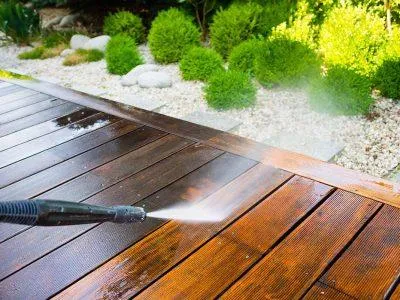 Painting Contractor Pressure Washing a Deck in Stoneham, MA